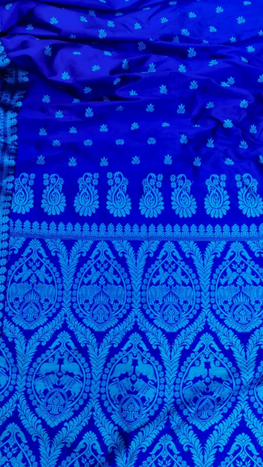 Side view of Assam Silk Thread Work Saree showing the elegant drape and fluid fall of pure mulberry silk with hand-embroidered thread detailing