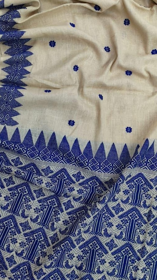 Close-up of hand-spun Eri silk handloom weave from Assam, tight even texture with natural depth, traditional pit loom craftsmanship