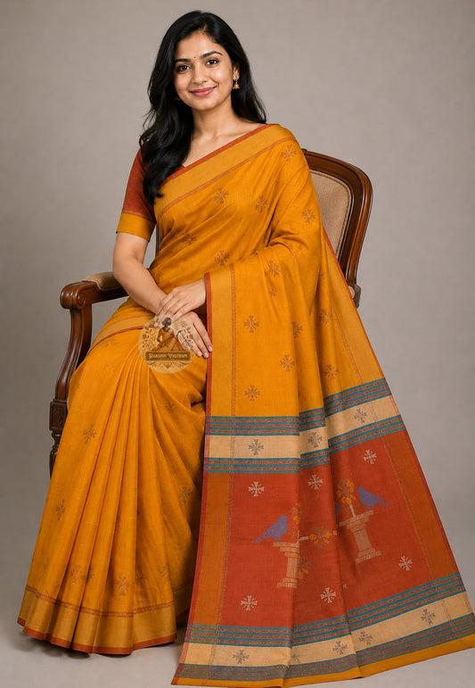Front view of woman wearing Bishnupur Katan Silk Saree with antique gold jewellery Janmashtami Durga Puja occasion