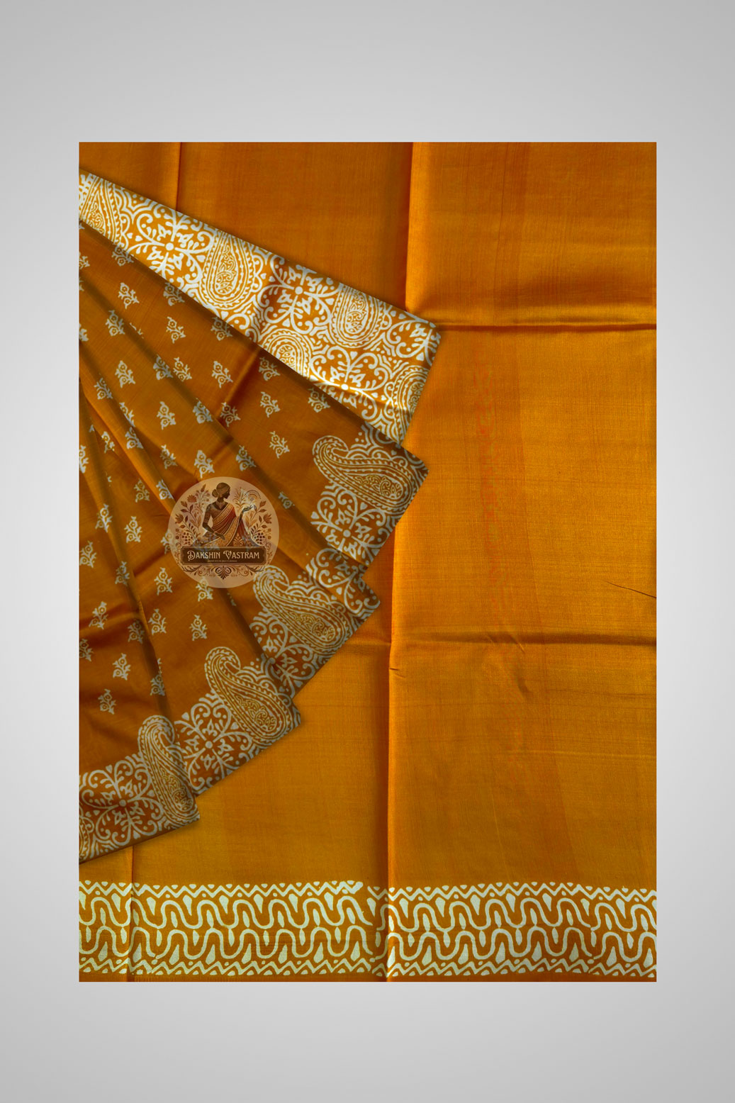 Close-up of Bishnupur block print saree motifs – terracotta temple-inspired patterns hand stamped on luminous pure silk fabric