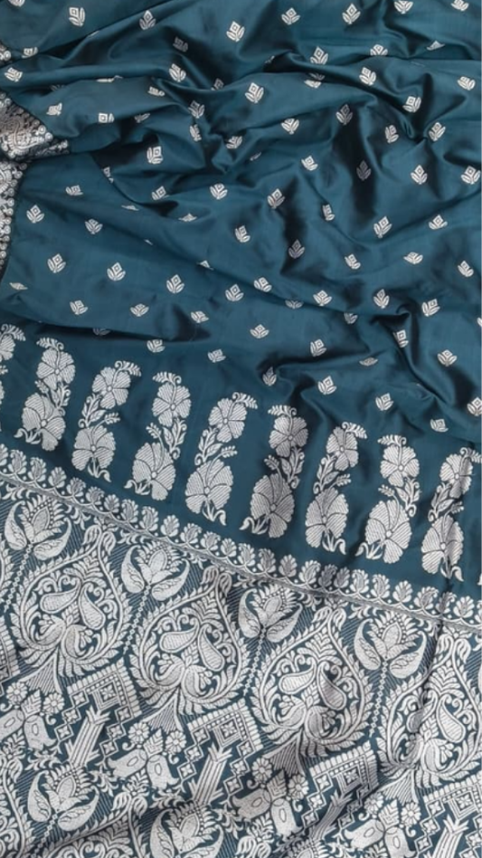 Handwoven Assam Mulberry Silk saree in natural ivory with traditional woven motifs, full drape on Indian model