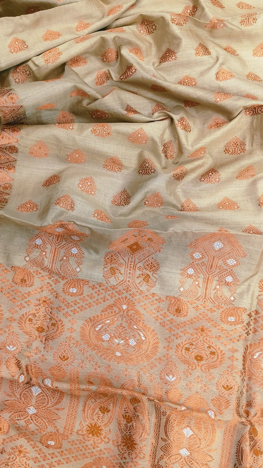 Handwoven Muga silk saree in warm amber-gold drape from Assam's Brahmaputra valley — Dakshin Vastram