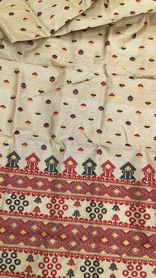 Front view of heirloom handloom Muga silk saree from Assam with naturally golden sheen that deepens with age, clean handloom weave built to outlast the occasion it was made for