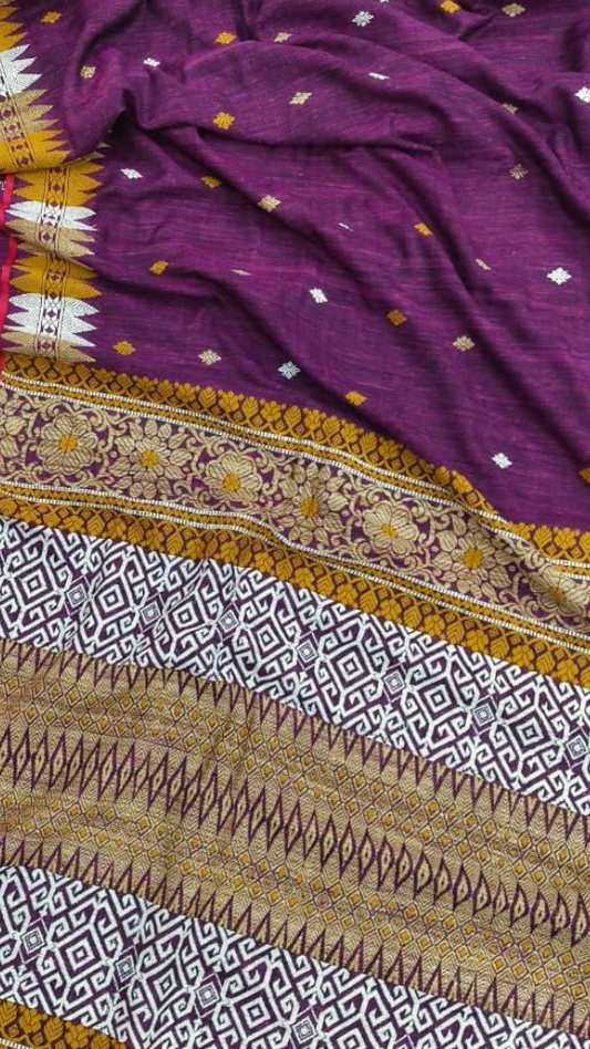 Close-up of pure Eri silk saree showing natural matte handwoven texture and handspun Assamese silk weave
