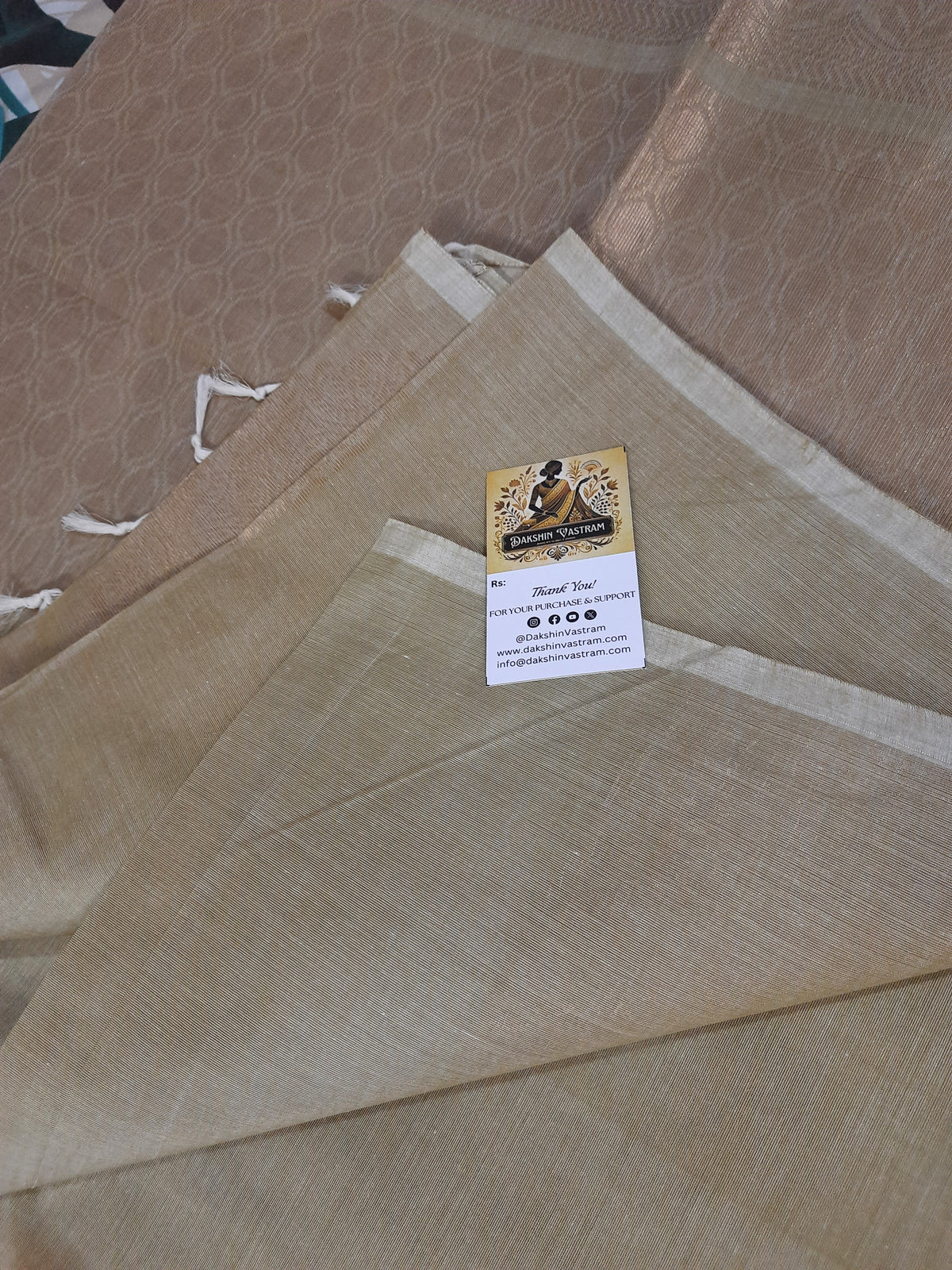 Side view of Handloom Copper Zari fabric highlighting smooth texture and traditional craftsmanship