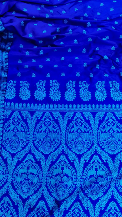 Side view of Assam Silk Thread Work Saree showing the elegant drape and fluid fall of pure mulberry silk with hand-embroidered thread detailing