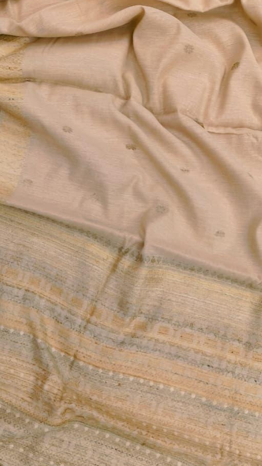 Close-up of hand-spun Eri silk handloom weave from Assam, natural soft texture, dense even weave by traditional artisans