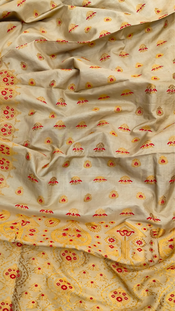 Side view of Pure Muga Silk Saree showing the natural golden sheen and elegant structured fall of handwoven Assam Muga silk, growing more lustrous with age and wear