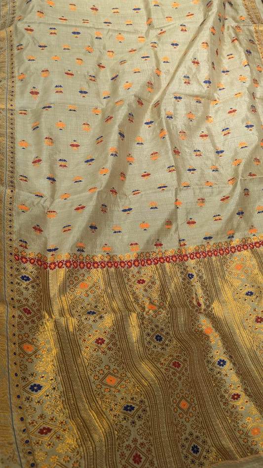 Close-up of naturally golden Muga silk weave – zero-dye sustainable handloom fabric from Assam