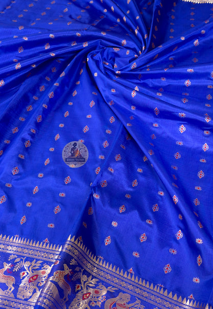 Rear view of royal blue Bishnupur Swarnachari saree showcasing richly woven gold zari pallu with mythological narrative scenes