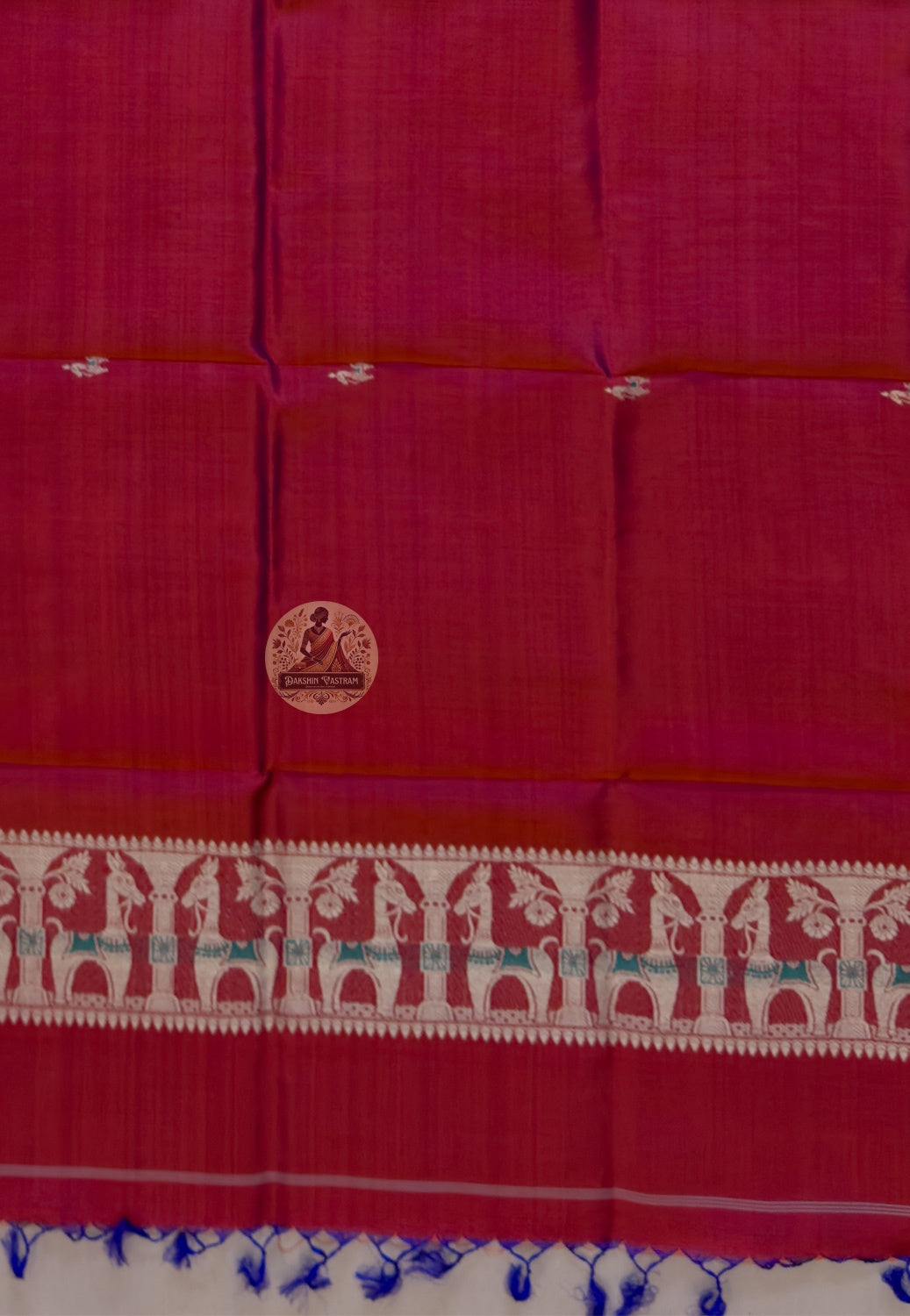 Close-up of pure silk fabric of Baluchari stole – deep crimson weave with delicate hand-woven buti motifs, naturally lustrous handloom silk from Bishnupur, West Bengal