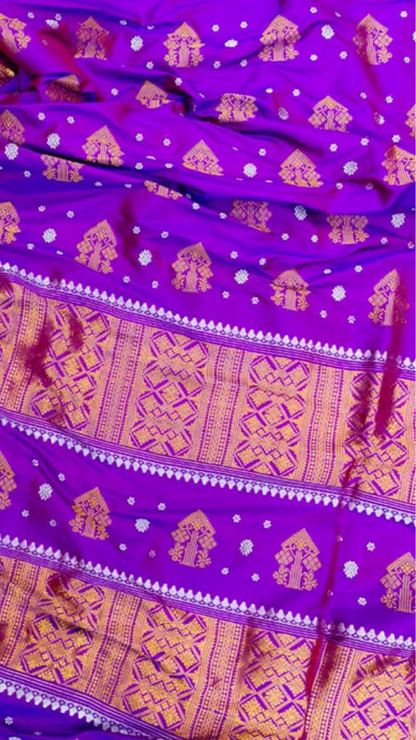 Rear view of Assam Mulberry Silk Copper Zari Saree displaying the handwoven copper zari pallu with traditional Assamese motifs and warm burnished metallic sheen