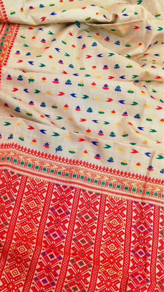 Indian woman wearing a traditional Muga Silk Saree from Assam – available for UK delivery