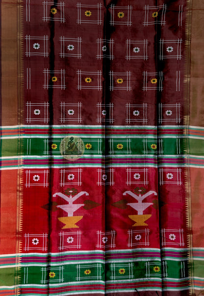 Close-up of Bishnupur Katan silk wedding saree weave showing tightly woven pure silk texture and traditional Bengal buti motifs formed in the weave