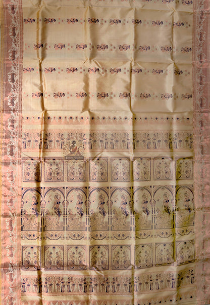 Side view of Bishnupur Swarnachari handloom silk saree displaying elegant drape and golden zari glow on cream pure silk