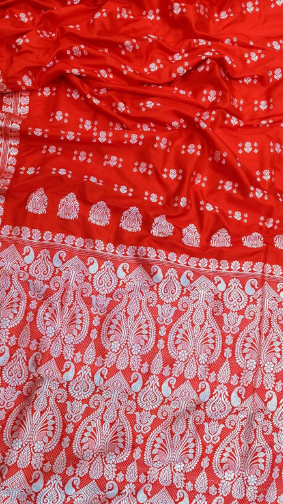 Indian woman draped in handwoven Assam Silk Saree with gold jewellery, styled for UK wedding and festive occasions – Dakshin Vastram