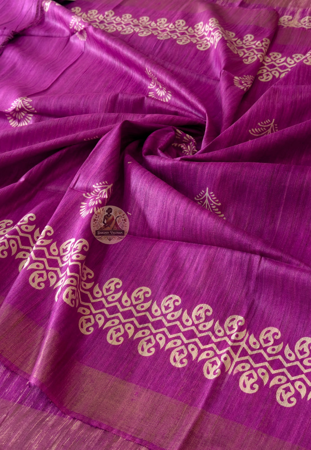 Close-up of Ghicha Tussar Silk weave revealing golden amber wild silk fibres, natural nubby texture and handloom depth — woven thread by thread by artisans carrying generations of knowledge