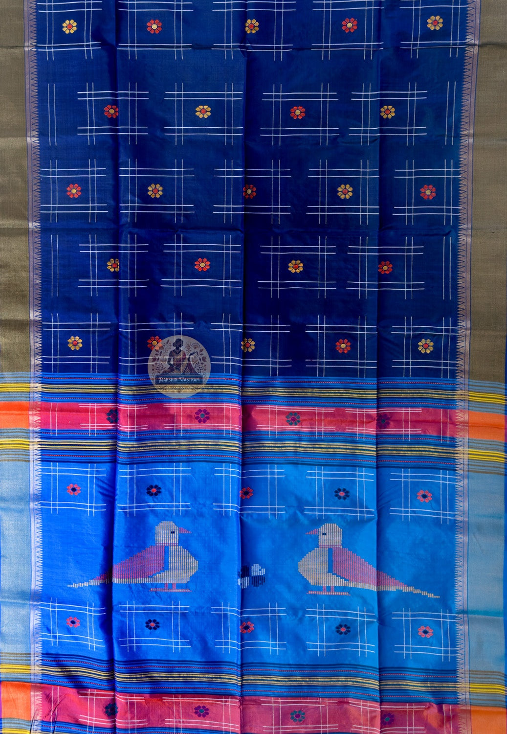 Close-up of Bishnupur Katan silk saree weave showing tightly twisted pure silk texture and traditional Bengal buti motifs formed in the weave itself
