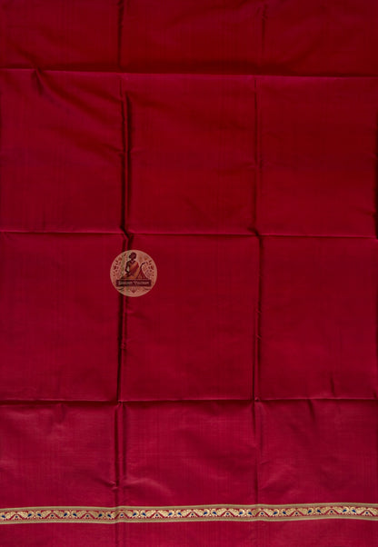 Detail shot of woven Baluchari border motifs on rich red silk kurti fabric — artisan handcrafted textile from Bishnupur