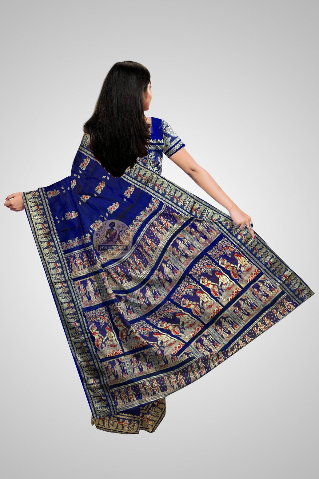 Close-up of Baluchari saree pallu with hand-woven mythological figures in zari thread on maroon silk