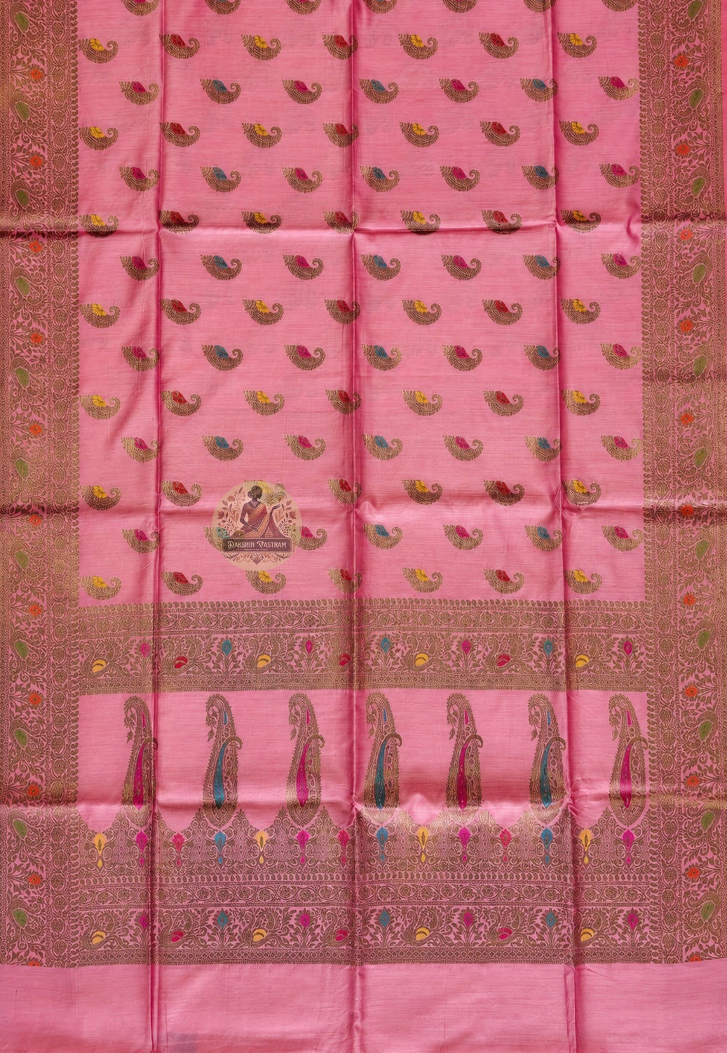 Close-up of master weaver's zari work on Banarasi Muga Tussar Saree showing intricate hand-laid gold thread motifs and dense Banarasi weave on natural golden silk