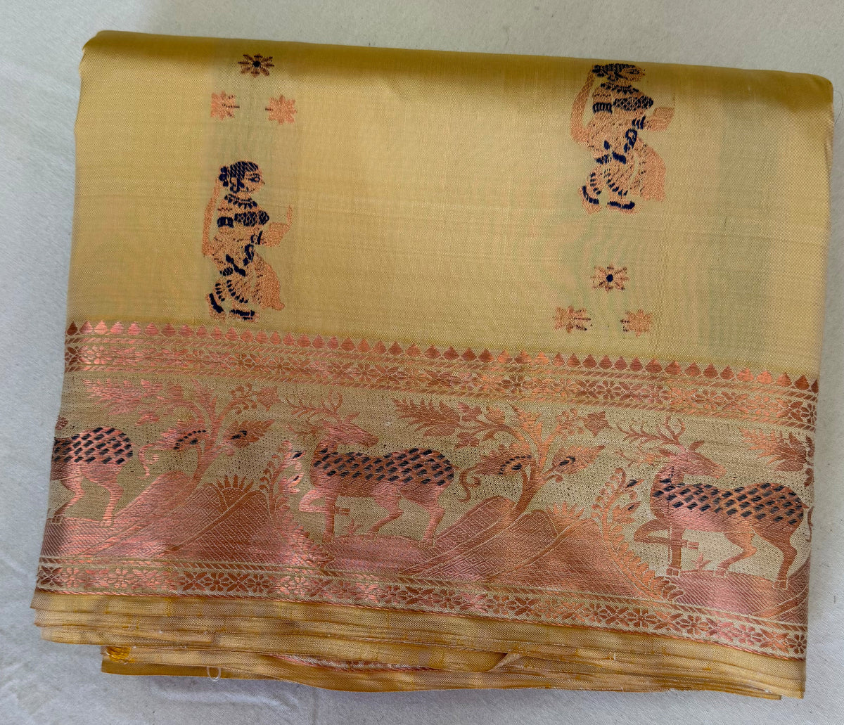 Rear view of Bishnupur Swarnachari saree showcasing richly woven zari pallu with devotional and mythological narrative motifs