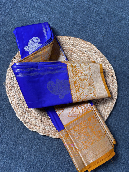 Semi Kanjivaram festive saree flat lay showing rich silk texture and temple motifs – Dakshin Vastram