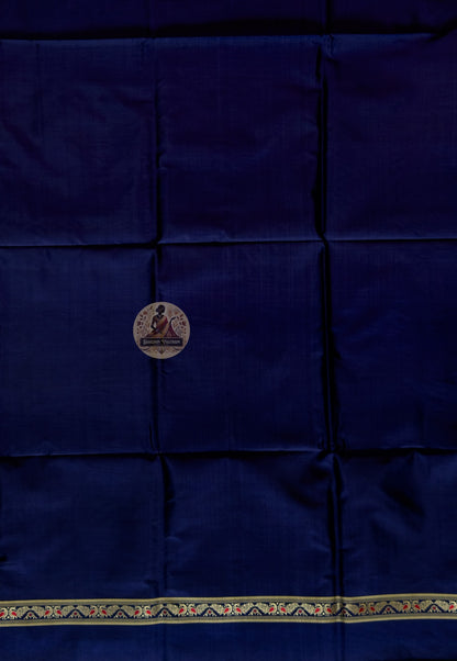 Detail shot of woven Baluchari border motifs on deep blue silk kurti fabric — artisan handcrafted textile from Bishnupur