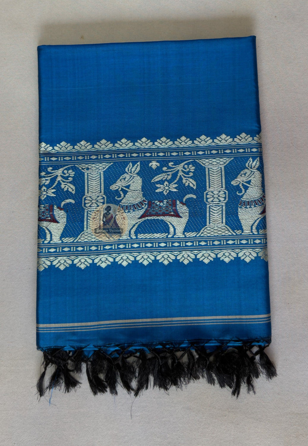 Pallu view of Baluchari silk stole – intricate hand-woven motifs of royal elephants and horses in mustard gold on deep violet pure silk, Bishnupur weave