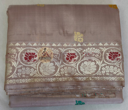 Back drape view of woman in Bishnupur Baluchari Silk saree showing pallu fall and natural lustre of pure Mulberry Silk