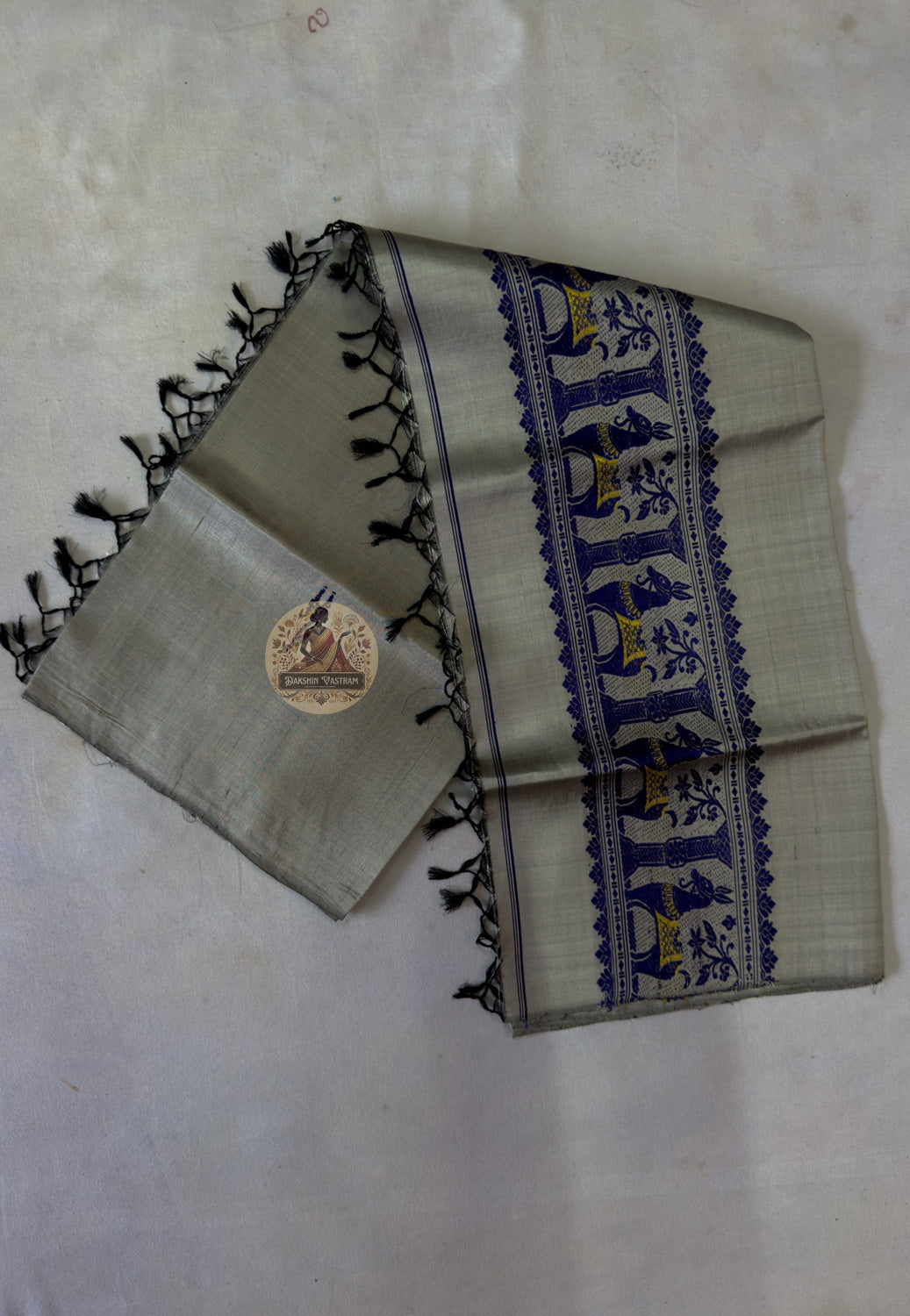 End panel detail of Baluchari pure silk stole – hand-knotted black silk tassels with royal blue woven narrative border, authentic Bishnupur Bengal handloom – Dakshin Vastram