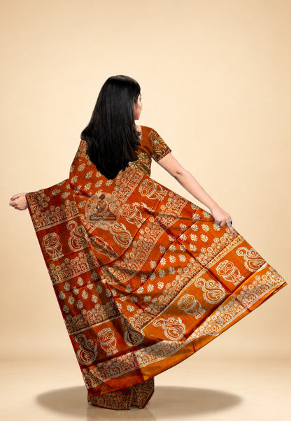Close-up of hand block print motifs on Bishnupur silk saree – traditional carved wooden block patterns in vibrant colour