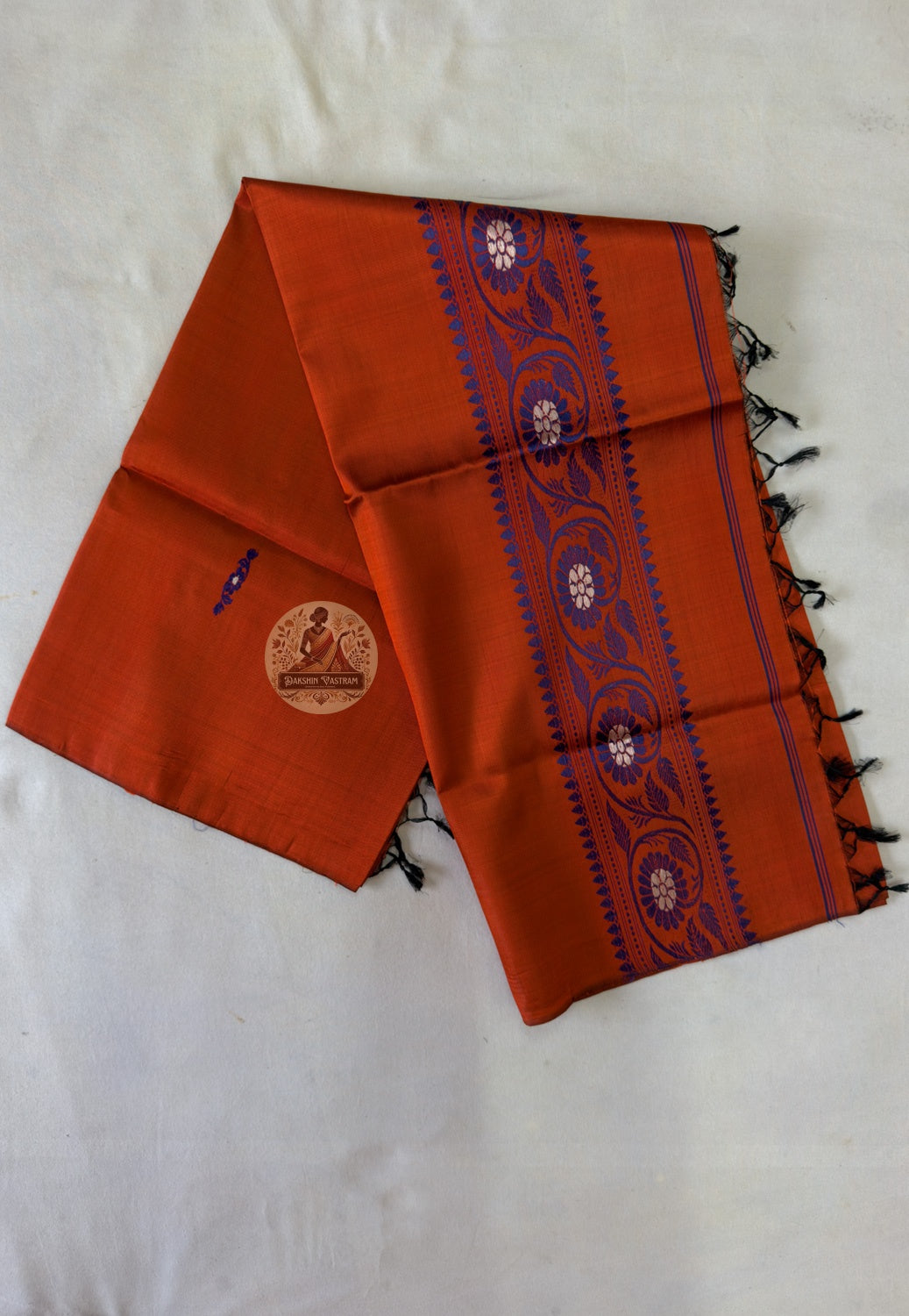 Border detail of handwoven Baluchari silk stole – intricate indigo blue chakra floral medallion motifs woven on brick red pure silk, traditional Bengal handloom craft