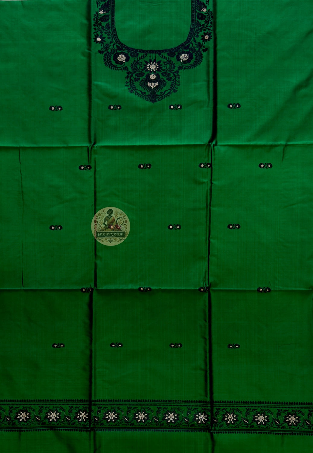 Flat lay of unstitched Baluchari silk kurti fabric in forest green showing full length and resham border pattern