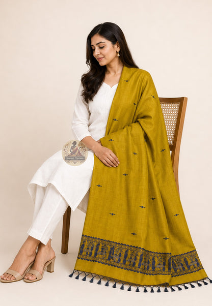 Relaxed drape view of handwoven Baluchari silk stole in turmeric yellow – pure silk with woven buti motifs and deep indigo border, perfect for Puja and festive occasions