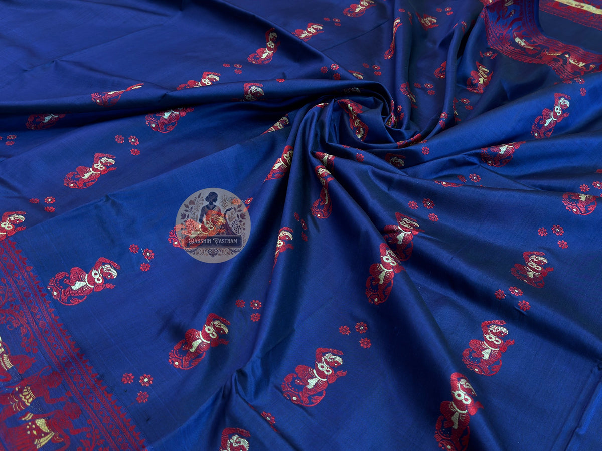 Detailed close-up of Baluchari Silk Saree border with handwoven figurative motifs and traditional Bengal weave pattern — each motif woven in silk, not printed or embroidered