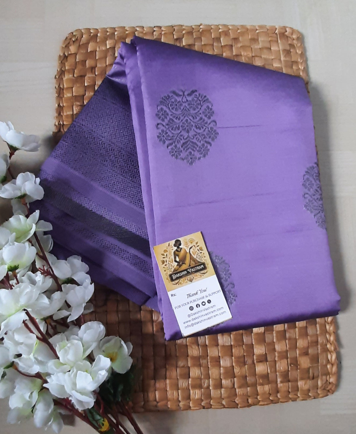 Side profile of the Mow Silk Saree draping elegantly with luxurious sheen.